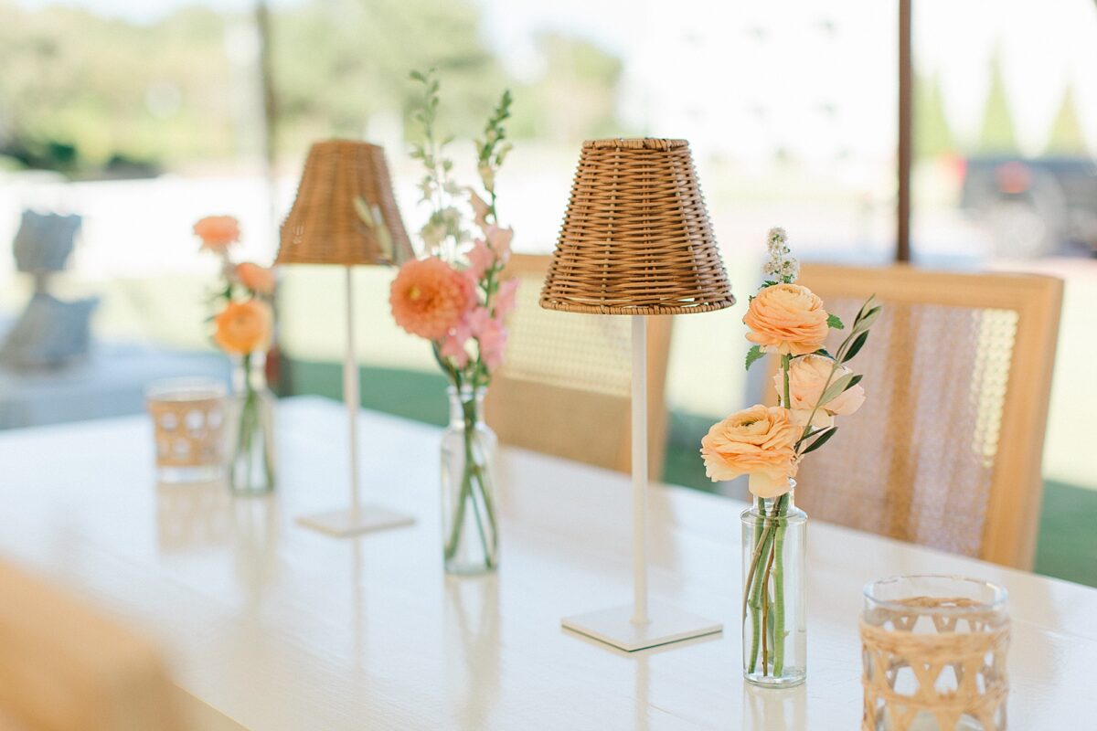 Wicker Table lights and rattan seating. Elevated Coastal Reception design 