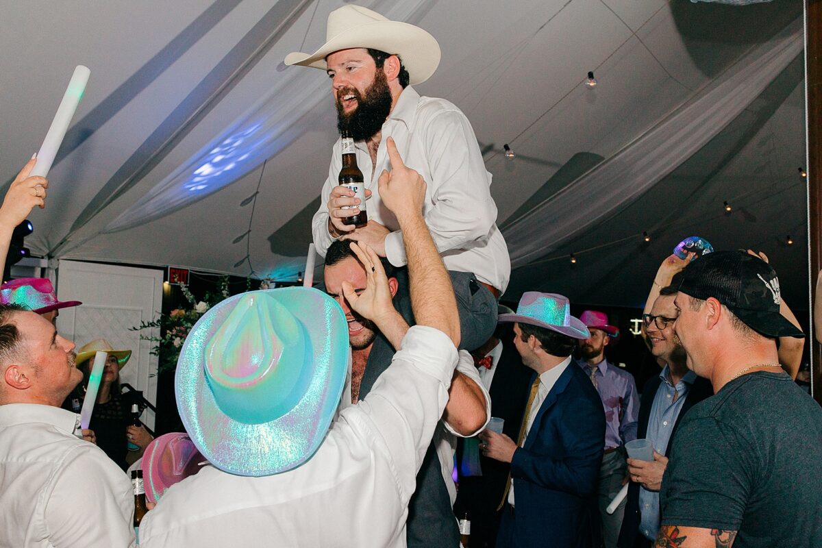 Dance floor reception under a sail cloth tent 