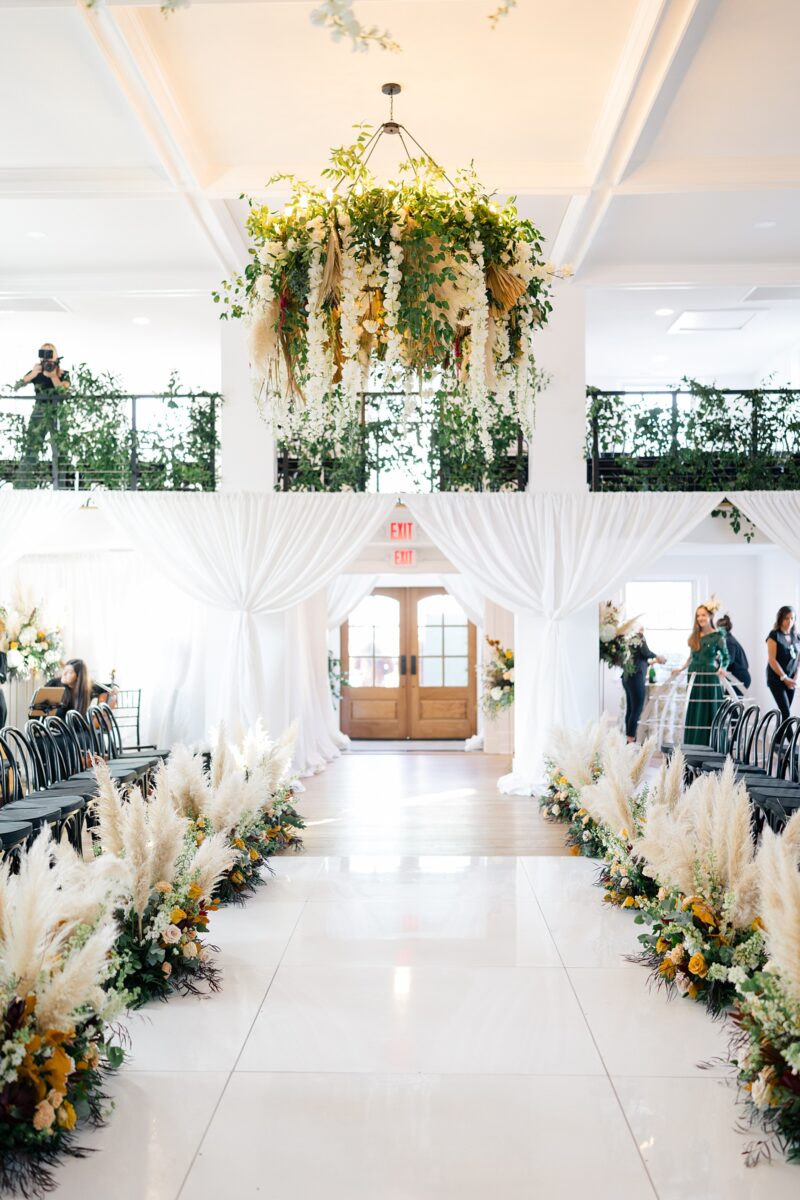 Fall meadow florals and hanging floral installation at Kindred Wedding and Events in Carolina Beach, NC