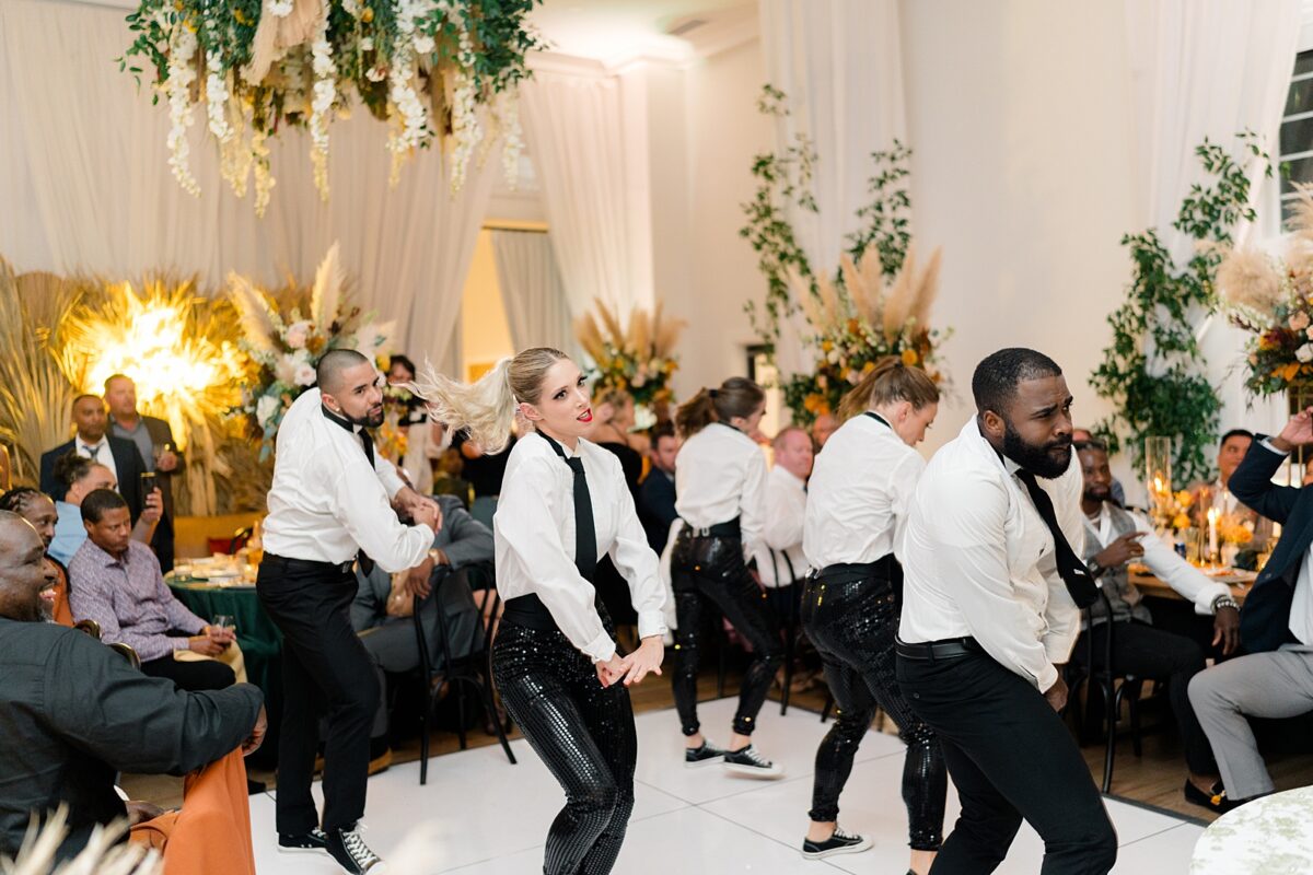 A flash dance mob durning a fall reception in the Kindred Wedding and Event Venue. A Brittanie Raquel Event. 