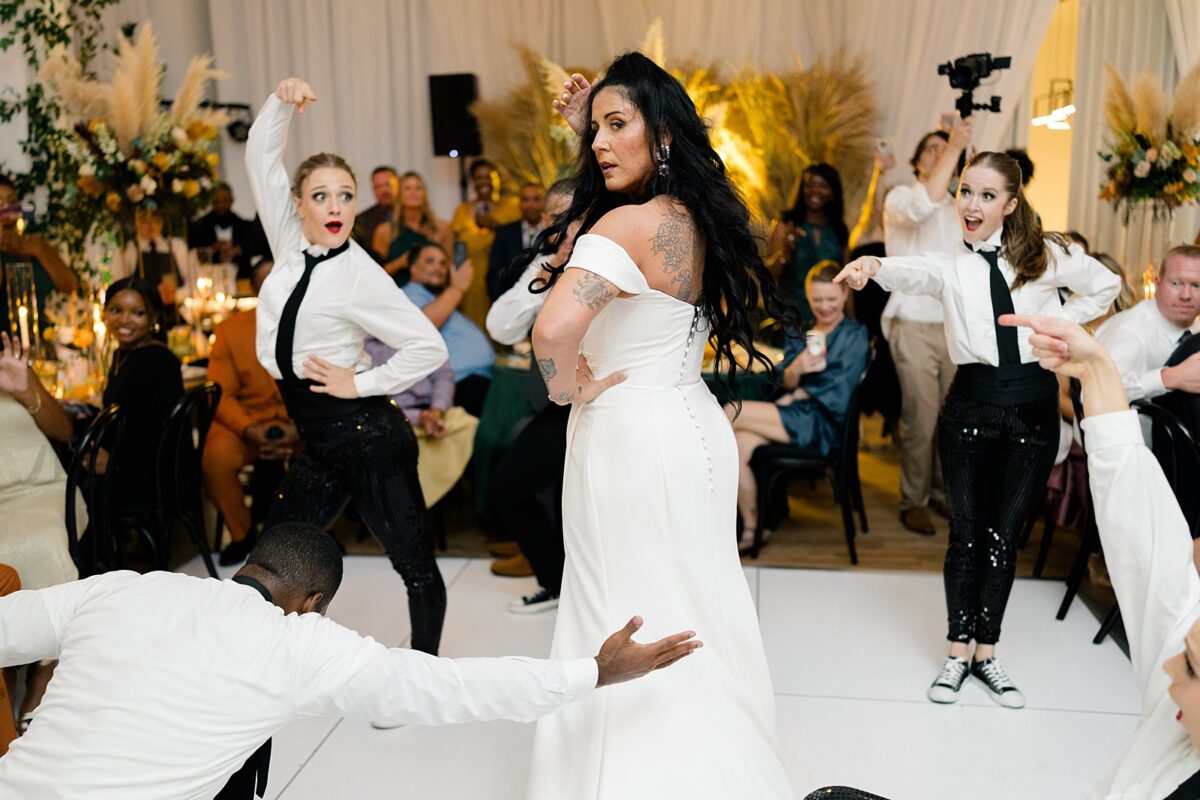 Flash mob joined by a fall bride at Kindred Wedding and Event Venue in Carolina Beach, NC. A wedding and event by Brittanie Raquel Events. 