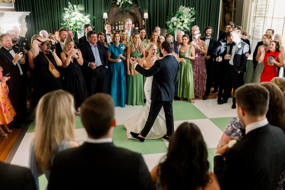 Couple dancing on green checkered dance floor at The Cape Fear Club 