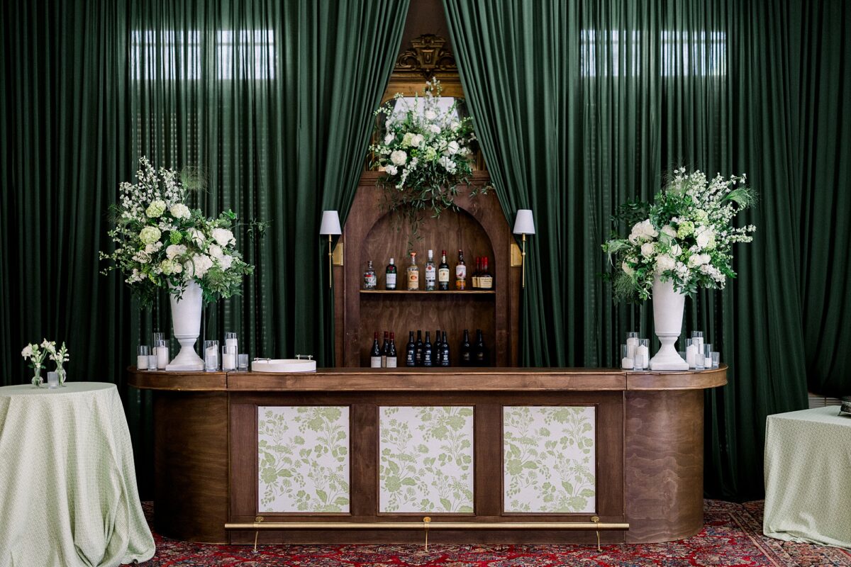 Wide shot of polo-lounge bar at The Cape Fear Club in downtown Wilmington with green draping